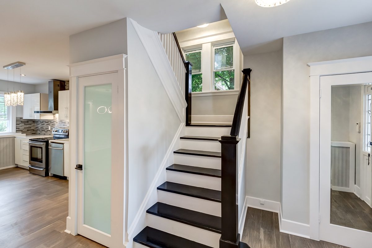 Detailed staircase painting with crisp white trim